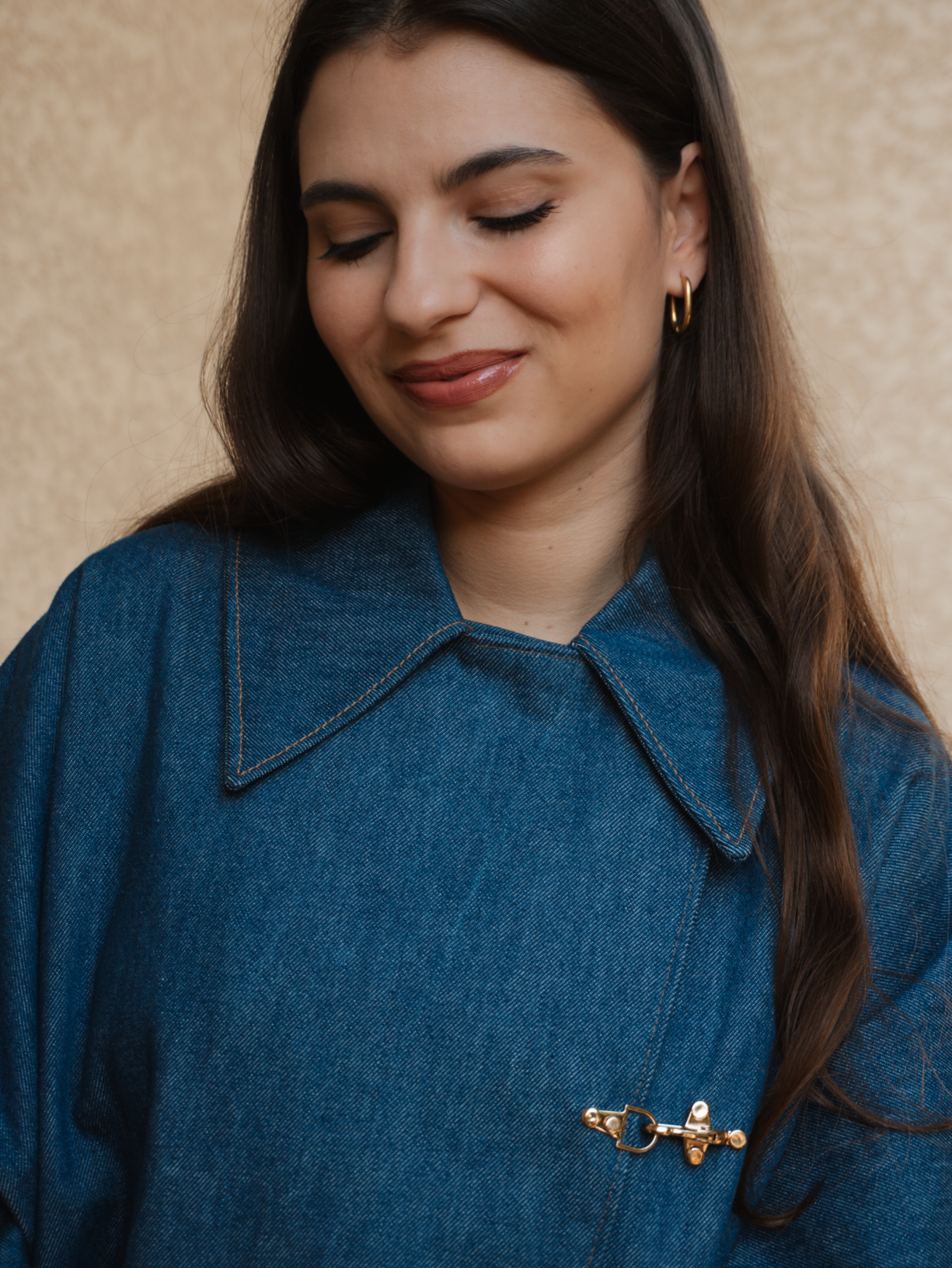 Fermeture boucle manteau